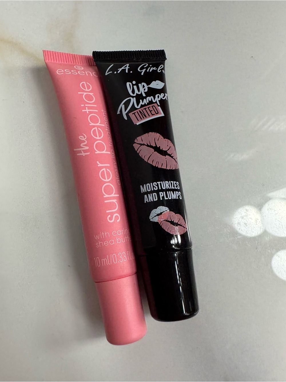 L.A. Girl Tinted Lip Plumper and Essence Super Pep